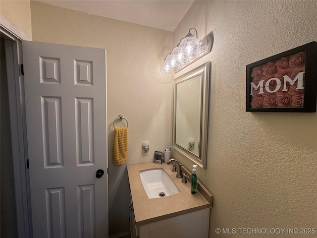 769 Terrace Dr, Prue, OK 74060 - bathroom featuring vanity and a textured wall