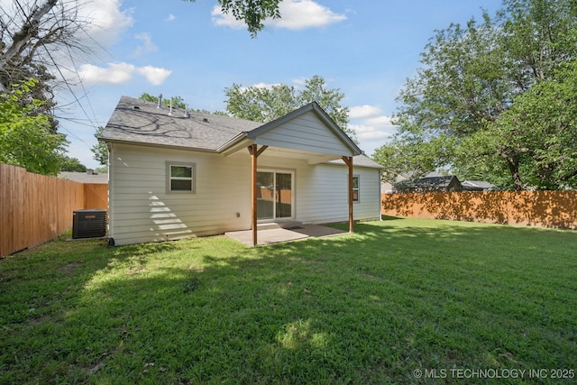 4534 E 5th Pl, Tulsa, OK 74112 - back of property with a patio area, a fenced backyard, and a shingled roof