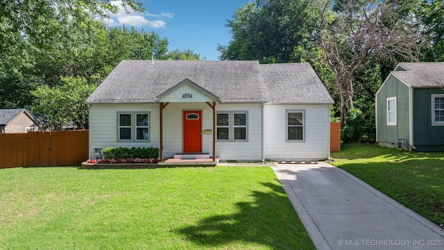 4534 E 5th Pl, Tulsa, OK 74112 - view of front of house with a shingled roof and driveway