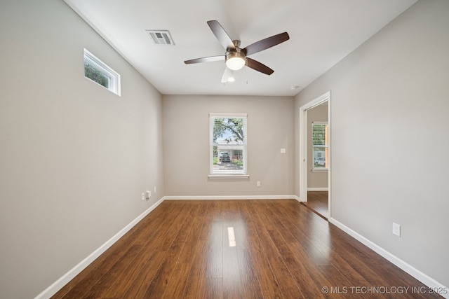 4534 E 5th Pl, Tulsa, OK 74112 - spare room with plenty of natural light, ceiling fan, and dark wood-style flooring