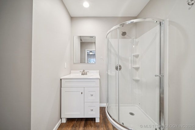 4534 E 5th Pl, Tulsa, OK 74112 - bathroom featuring a stall shower, wood finished floors, and vanity