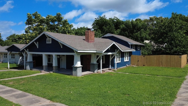 609 E Ward St, Tahlequah, OK 74464 - view of front of property with covered porch, a chimney, and a shingled roof