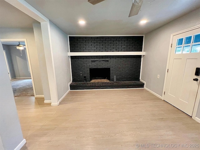 609 E Ward St, Tahlequah, OK 74464 - unfurnished living room with ceiling fan, wood finished floors, a fireplace, and recessed lighting
