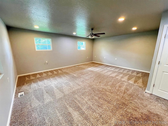 609 E Ward St, Tahlequah, OK 74464 - carpeted spare room featuring a ceiling fan, plenty of natural light, recessed lighting, and a textured ceiling