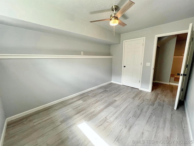 609 E Ward St, Tahlequah, OK 74464 - unfurnished bedroom featuring wood finished floors and a ceiling fan
