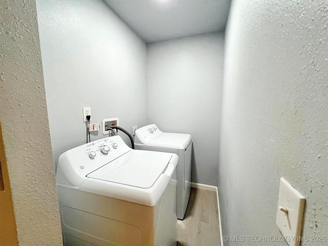 609 E Ward St, Tahlequah, OK 74464 - laundry room with washing machine and clothes dryer and wood finished floors