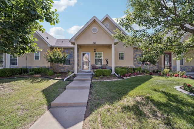 445 S Cypress Ave, Broken Arrow, OK 74012 - view of front of house with stone siding, a front lawn, stucco siding, and covered porch