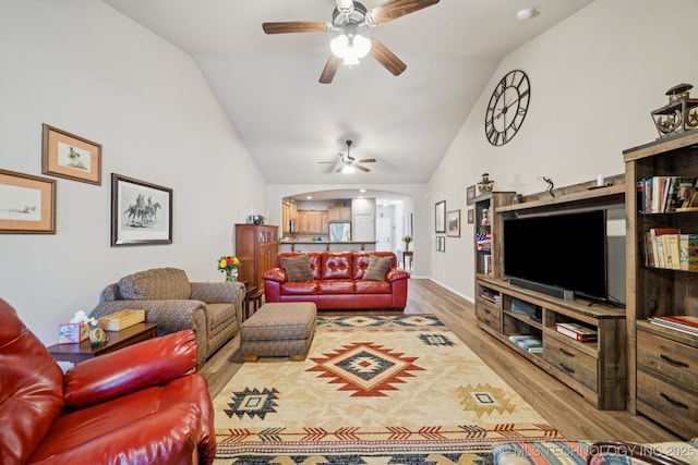 445 S Cypress Ave, Broken Arrow, OK 74012 - living room featuring a ceiling fan, wood finished floors, arched walkways, and high vaulted ceiling