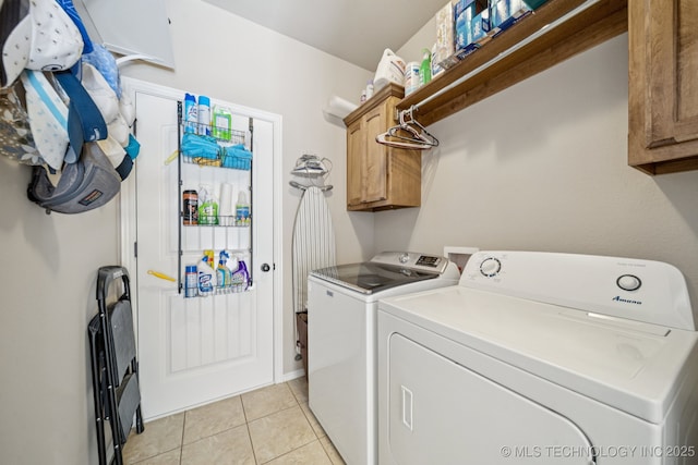 445 S Cypress Ave, Broken Arrow, OK 74012 - washroom featuring independent washer and dryer, cabinet space, and light tile patterned flooring