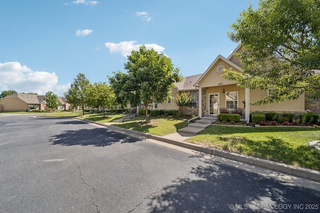 445 S Cypress Ave, Broken Arrow, OK 74012 - view of front of home with stucco siding, stone siding, a front lawn, and a residential view