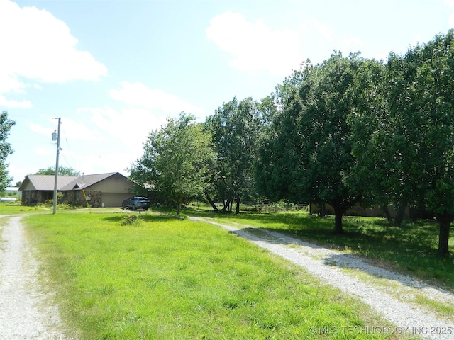 399987 W 3700th Rd, Ramona, OK 74061 - view of grassy yard featuring driveway
