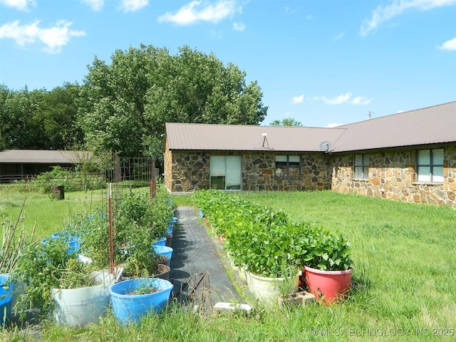 399987 W 3700th Rd, Ramona, OK 74061 - view of green lawn with a vegetable garden