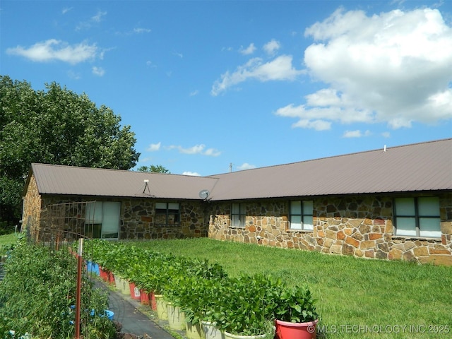 399987 W 3700th Rd, Ramona, OK 74061 - view of front facade with stone siding and a metal roof