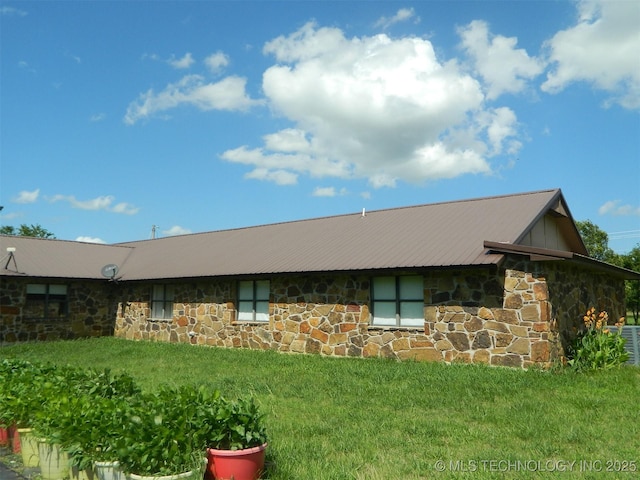 399987 W 3700th Rd, Ramona, OK 74061 - view of front of home with stone siding, a front lawn, and a metal roof