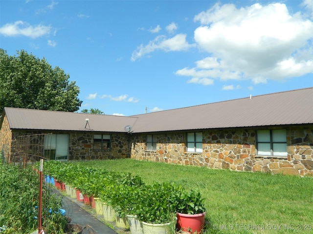 399987 W 3700th Rd, Ramona, OK 74061 - view of front of home with stone siding, a metal roof, and a front lawn