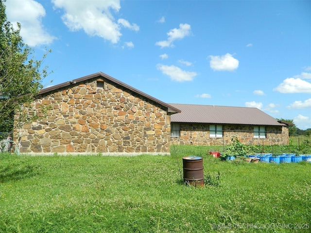 399987 W 3700th Rd, Ramona, OK 74061 - rear view of property with stone siding and a lawn