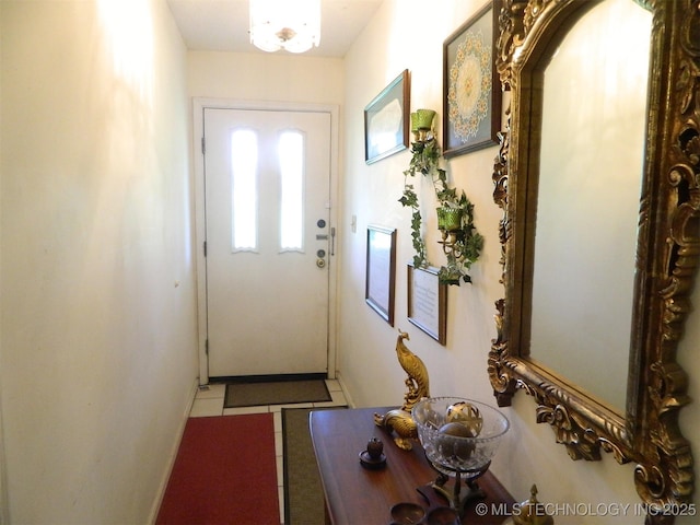 399987 W 3700th Rd, Ramona, OK 74061 - doorway to outside featuring light tile patterned floors and baseboards
