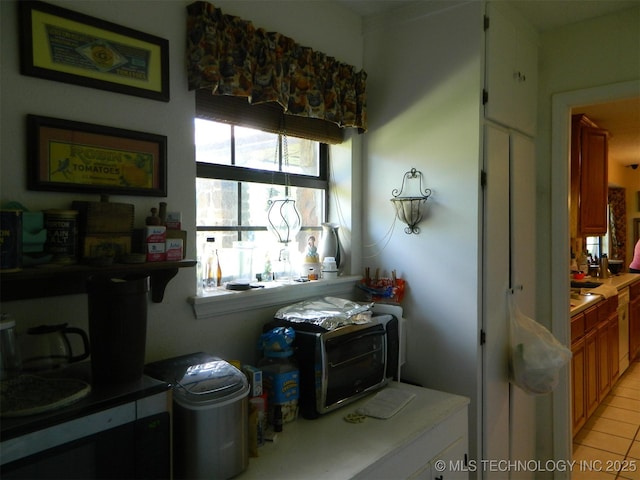 399987 W 3700th Rd, Ramona, OK 74061 - kitchen with light tile patterned flooring