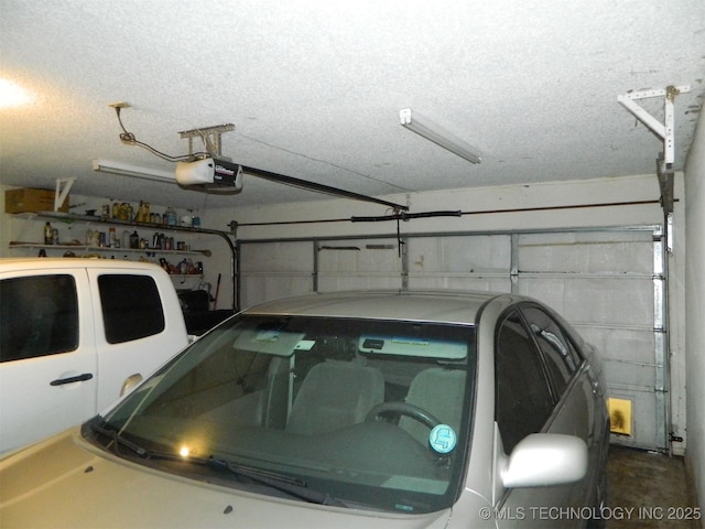 399987 W 3700th Rd, Ramona, OK 74061 - garage featuring a garage door opener