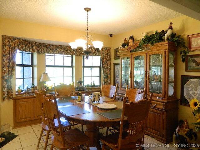 399987 W 3700th Rd, Ramona, OK 74061 - dining space with a chandelier, light tile patterned flooring, and healthy amount of natural light