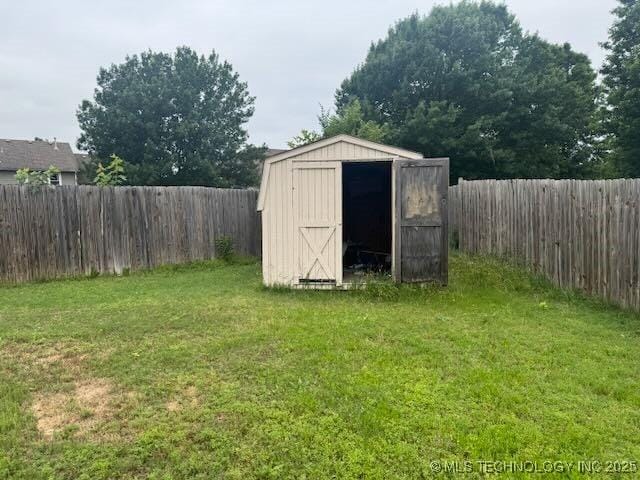 908 S Umbrella Cir, Broken Arrow, OK 74012 - view of shed with a fenced backyard