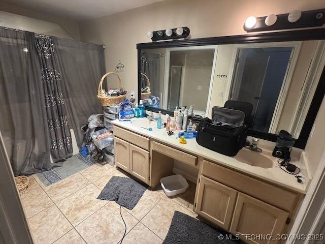 908 S Umbrella Cir, Broken Arrow, OK 74012 - bathroom with tile patterned flooring, vanity, and curtained shower
