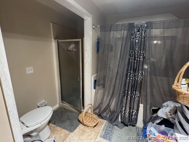 908 S Umbrella Cir, Broken Arrow, OK 74012 - bathroom featuring a shower stall and tile patterned flooring