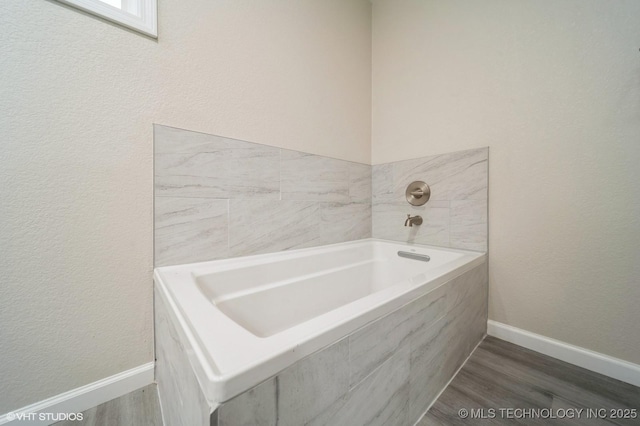 25530 S 608th Ct, Grove, OK 74344 - bathroom with a garden tub and wood finished floors