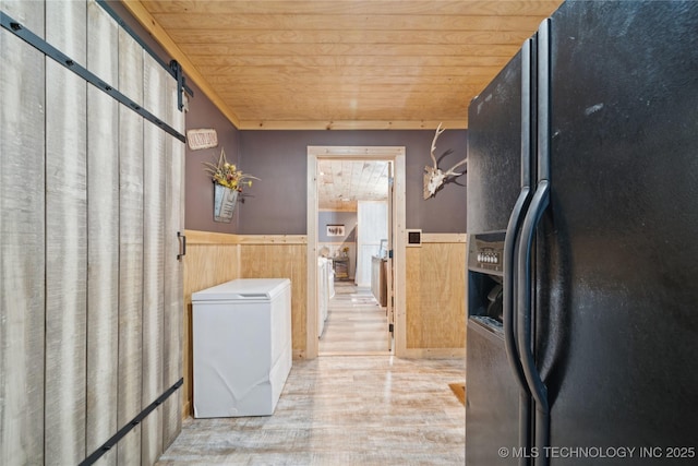 719 Oklahoma Ave, Wynona, OK 74084 - washroom featuring wood ceiling, a wainscoted wall, and wood finished floors