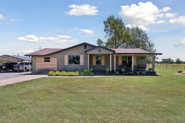 719 Oklahoma Ave, Wynona, OK 74084 - view of front of property with a porch, a front yard, and a carport