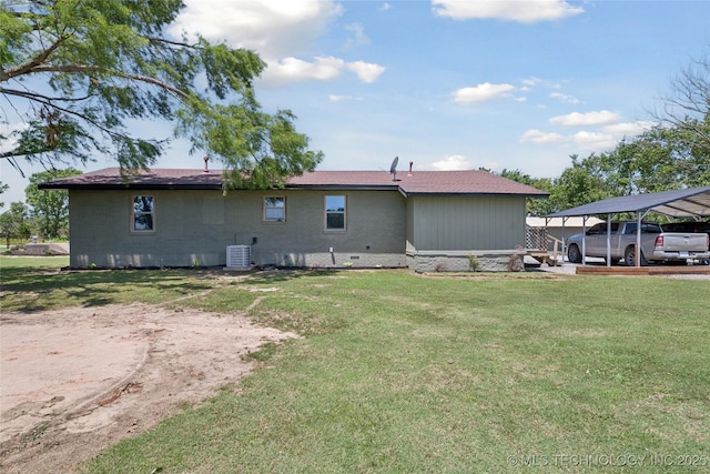 719 Oklahoma Ave, Wynona, OK 74084 - back of property featuring a carport, a yard, and crawl space
