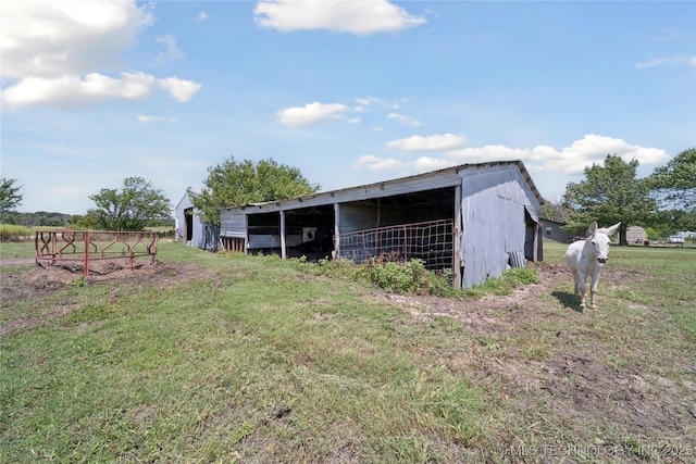 719 Oklahoma Ave, Wynona, OK 74084 - view of pole building with a lawn