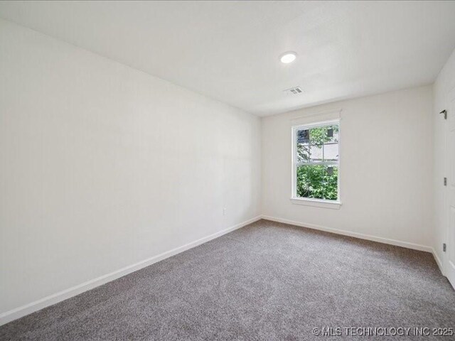 409 N Cherokee St, Claremore, OK 74017 - empty room with baseboards and carpet flooring