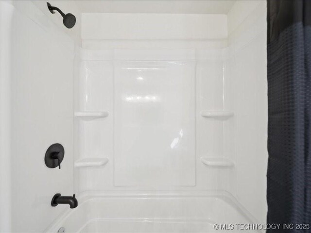 409 N Cherokee St, Claremore, OK 74017 - full bathroom featuring shower / bath combo with shower curtain
