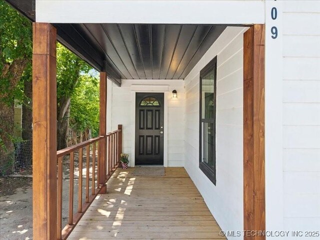 409 N Cherokee St, Claremore, OK 74017 - view of exterior entry featuring a porch