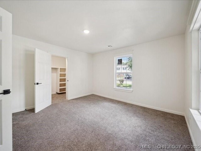 409 N Cherokee St, Claremore, OK 74017 - carpeted empty room featuring baseboards and recessed lighting