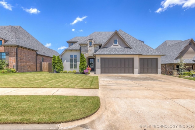 449 E 129th Pl, Jenks, OK 74037 - french country home featuring stucco siding, an attached garage, concrete driveway, a front yard, and a shingled roof