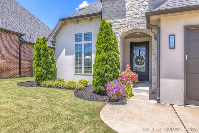 449 E 129th Pl, Jenks, OK 74037 - property entrance with stucco siding, a lawn, and stone siding