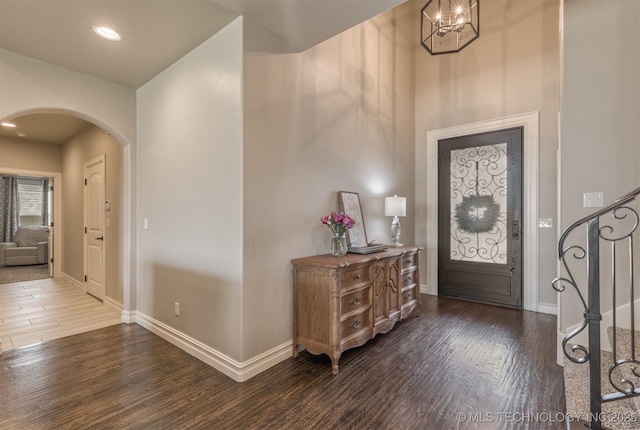 449 E 129th Pl, Jenks, OK 74037 - foyer with arched walkways, dark wood-style floors, and recessed lighting