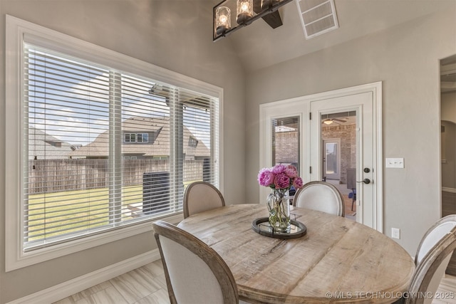 449 E 129th Pl, Jenks, OK 74037 - dining room with vaulted ceiling and a chandelier