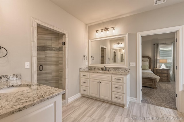 449 E 129th Pl, Jenks, OK 74037 - full bathroom with two vanities, a shower stall, and ensuite bath