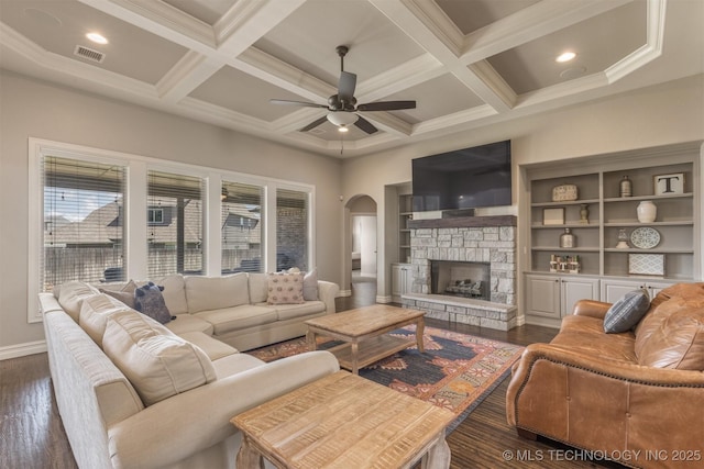 449 E 129th Pl, Jenks, OK 74037 - living room with arched walkways, a ceiling fan, dark wood-style flooring, coffered ceiling, and beam ceiling