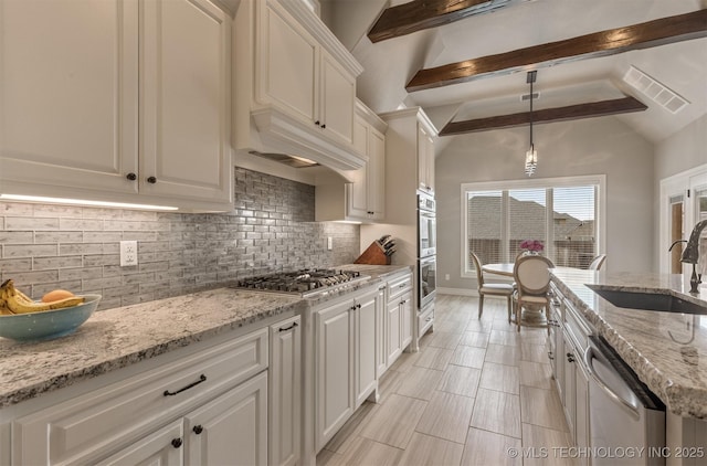 449 E 129th Pl, Jenks, OK 74037 - kitchen with stainless steel appliances, decorative backsplash, white cabinetry, and light stone countertops