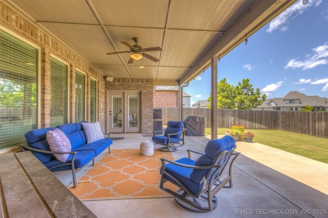 449 E 129th Pl, Jenks, OK 74037 - fenced backyard with ceiling fan, a patio, and an outdoor living space