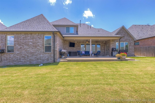 449 E 129th Pl, Jenks, OK 74037 - rear view of house with brick siding, a patio area, ceiling fan, an outdoor living space, and roof with shingles