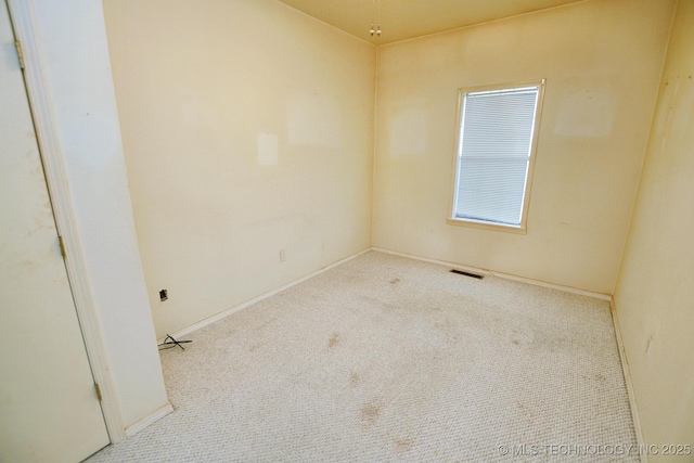 16759 W Burchett Rd, Tahlequah, OK 74464 - empty room with carpet floors and baseboards