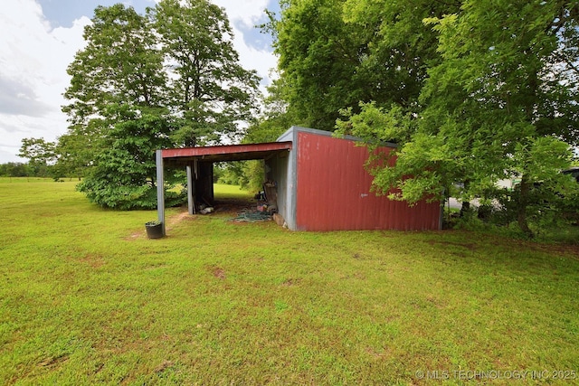 16759 W Burchett Rd, Tahlequah, OK 74464 - view of grassy yard with an outbuilding and a pole building