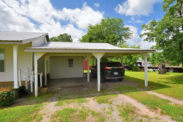 16759 W Burchett Rd, Tahlequah, OK 74464 - view of parking with dirt driveway and an attached carport