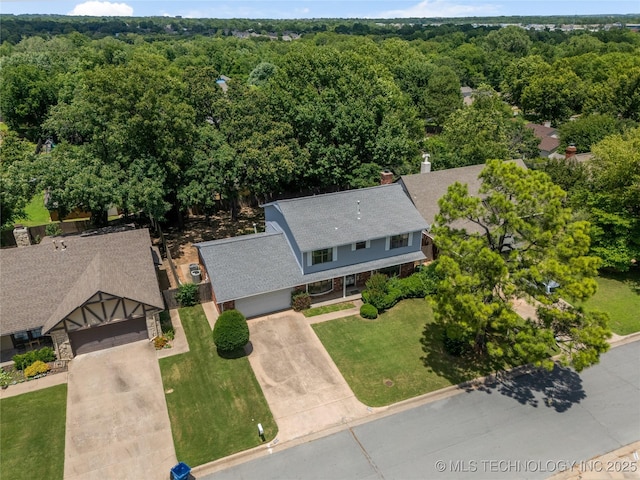 7033 E 99th St, Tulsa, OK 74133 - aerial view of property and surrounding area with a heavily wooded area