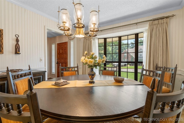 7033 E 99th St, Tulsa, OK 74133 - dining space with a chandelier, ornamental molding, a textured ceiling, and wallpapered walls